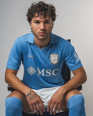 A promotional studio photo of a player wearing the SSC Napoli home shirt by EA7.