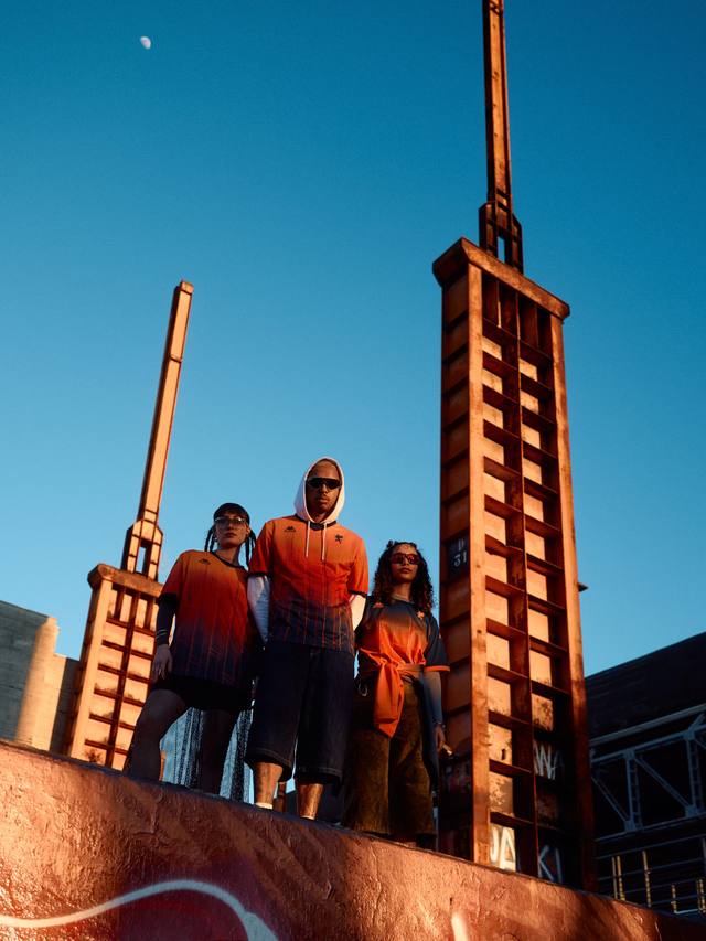 Models wear the Genoa CFC x Kappa FuturFestival special edition shirt in an industrial setting