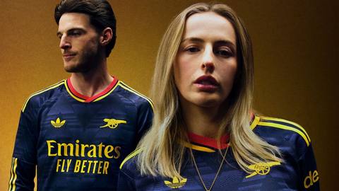 Declan Rice and Leah Williamson model the navy and yellow Arsenal away shirt.