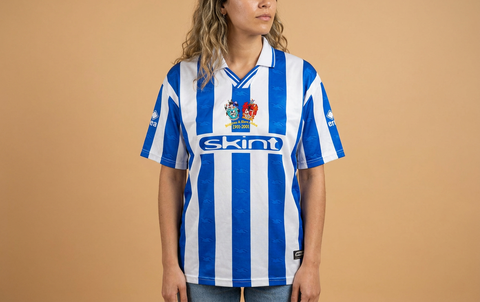 AI recreation of the Brighton & Hove Albion home 2001 shirt, generated by Kitlist from its documented design record.