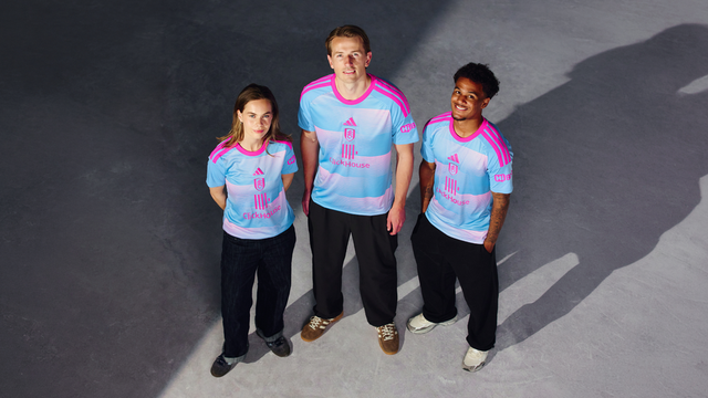 Fulham FC players presenting the new third shirt featuring a blue and pink gradient design