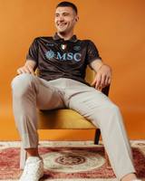 Alessandro Buongiorno wears the SSC Napoli 2025/26 'Café' third shirt by EA7.