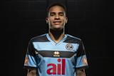 A portrait of a player wearing the FC Lugano 2024/25 third shirt designed by Erreà.