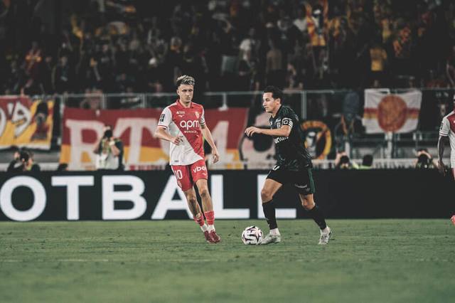 An AS Monaco player wearing the 2024/25 home shirt during a match.